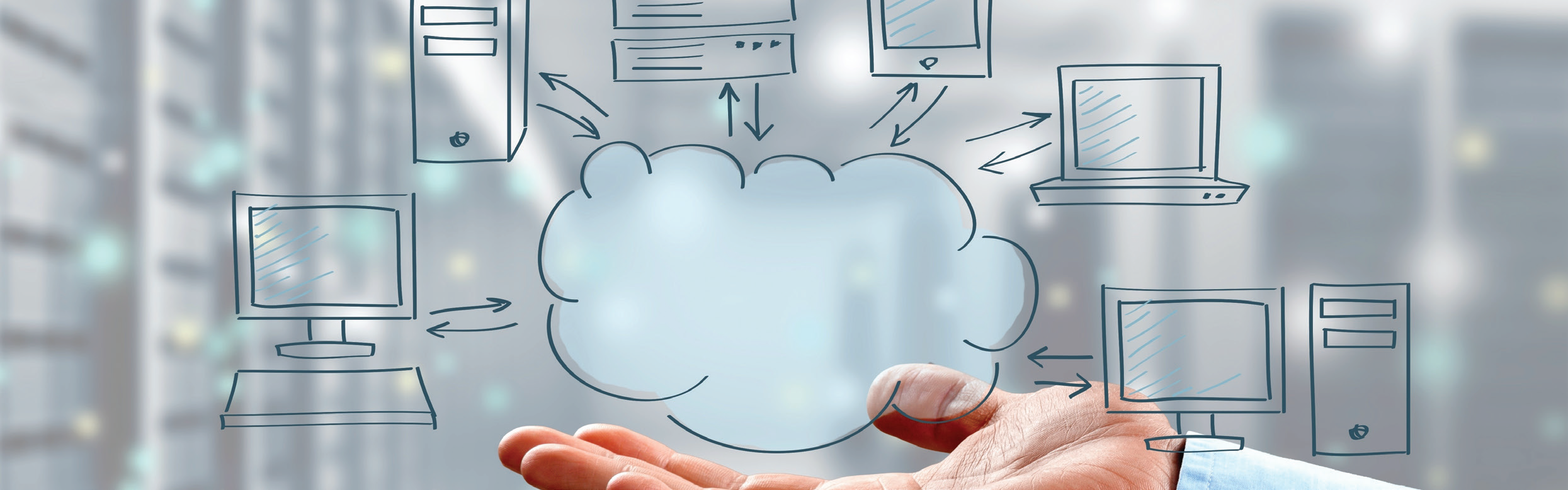 Image of a hand holding a cloud with a computer, filer and tablets floating over it